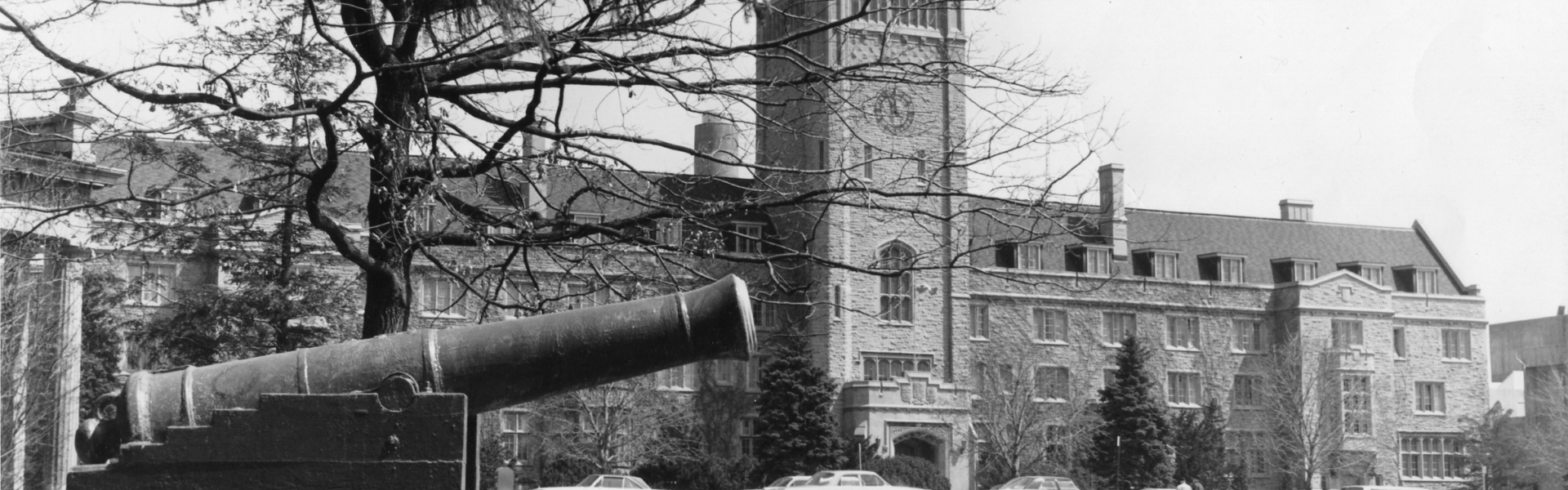 An old black and white photo of the U of G cannon in front of Johnston Hall.