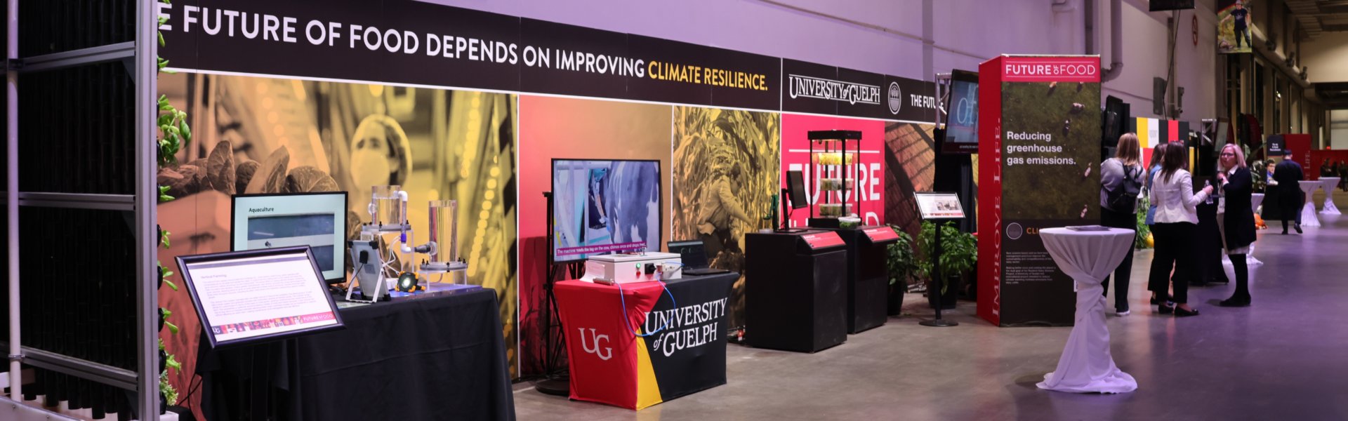 A hallway with U of G's exhibit at the Royal Agricultural Fair, with signs reading The Future of Food Depends on Improving Climate Resilience