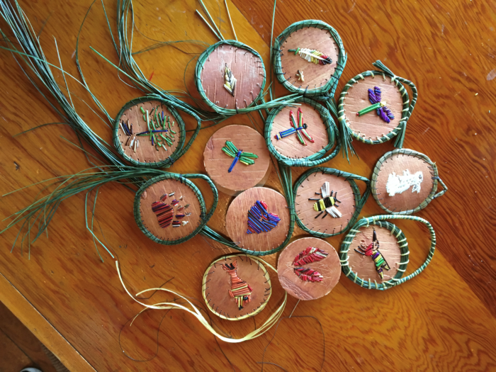 Small round medallions with different designs embroidered in the middle.