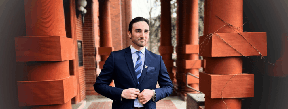 Daniel Neiterman posed in navy blue suit