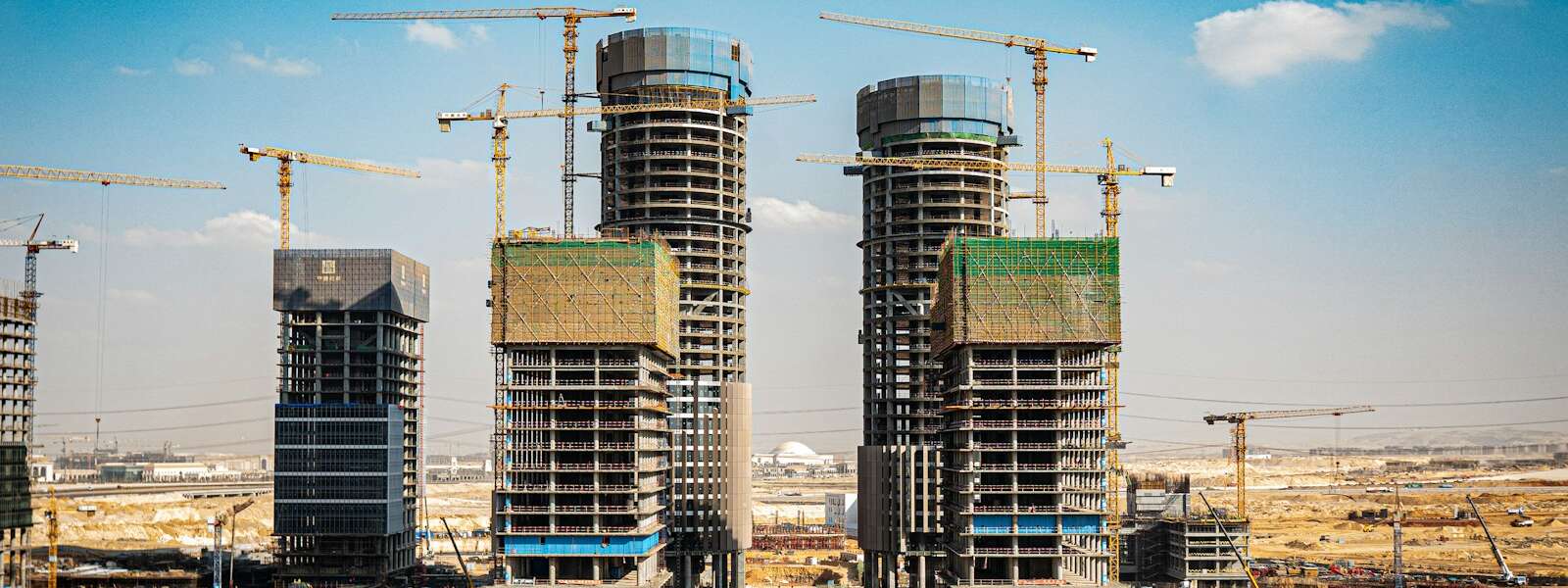 a group of tall buildings under construction