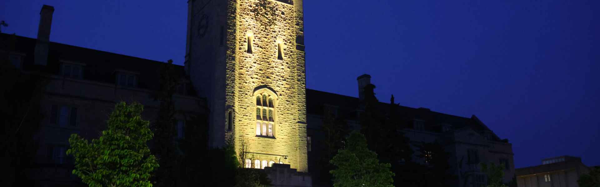 Johnston Hall lit yellow.