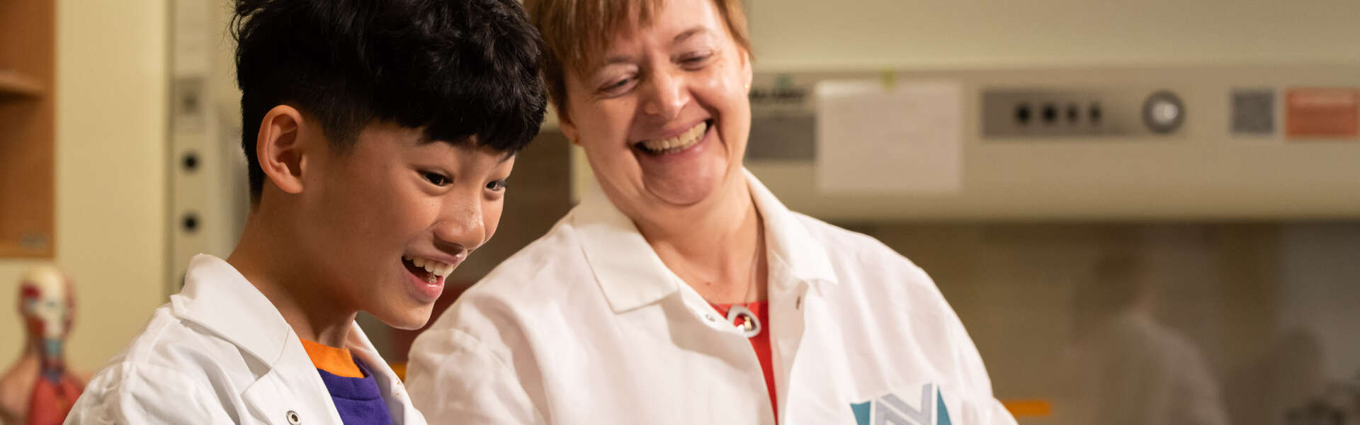 people in lab coats in a lab