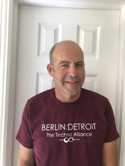 a person in a burgundy t-shirt