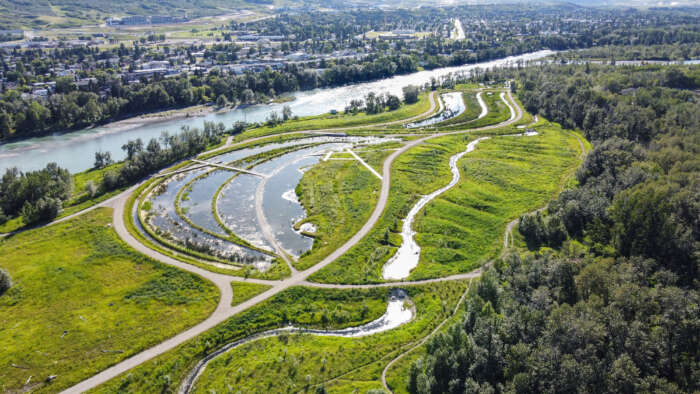 Dale Hodges Park aerial view, featuring a green park next to a river with various walking paths.