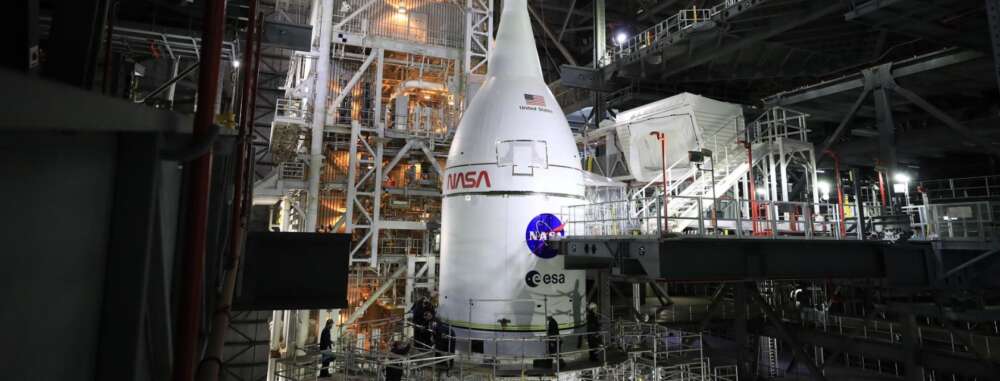 a spacecraft with nasa written on it in an industrial space