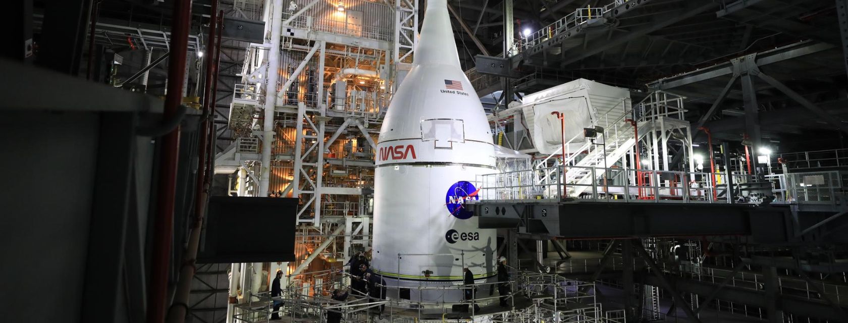 a spacecraft with nasa written on it in an industrial space